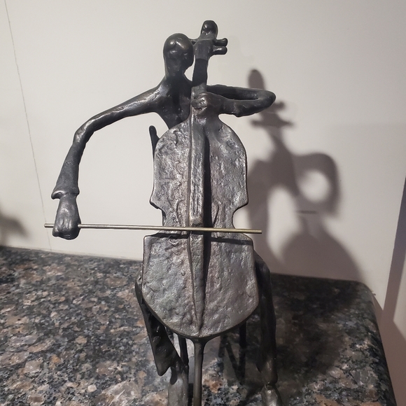 Other - sculpture of cellist approx 4 lbs weights.shown singular and in a group...